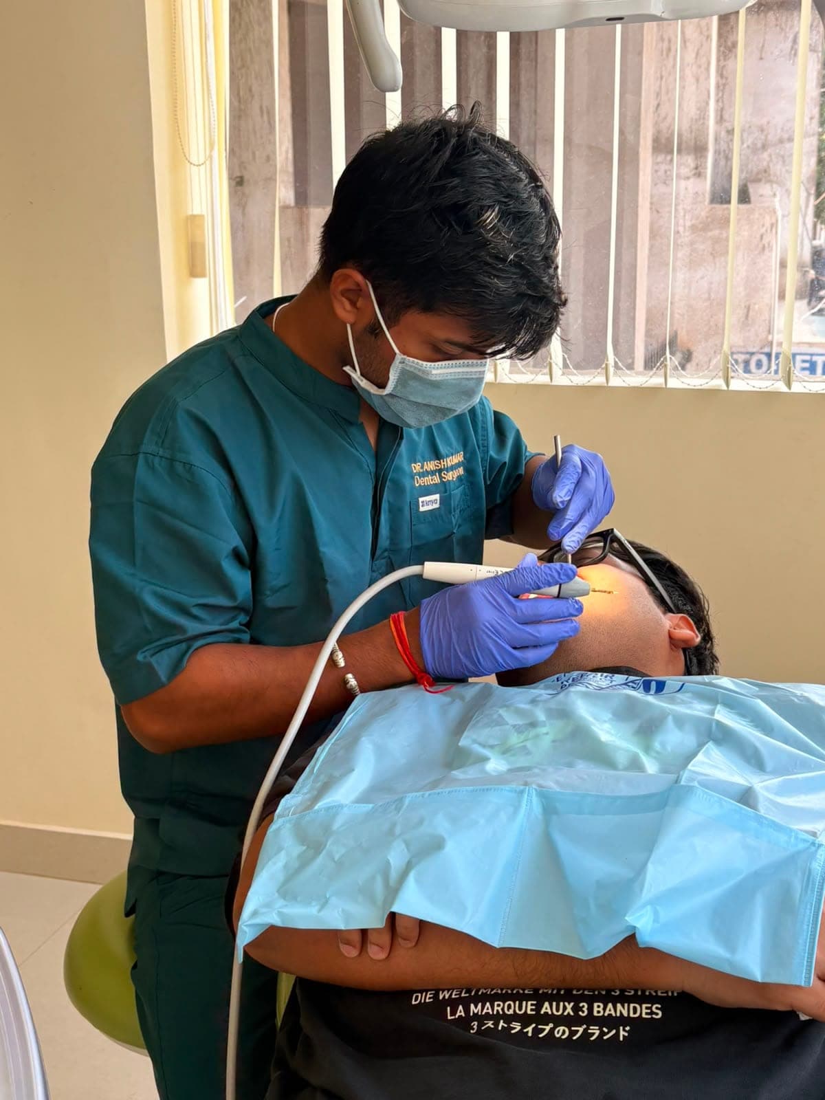 Happy patient at Anident Dental Care & Implant Center
